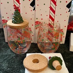 NIB Temptations set of 2 wine glasses w/matching toppers